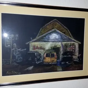 A framed pastel work by Ann Tiley, a regular performer at the Idle Hour Tavern and talented artist.