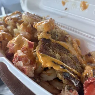 Mac and Cheese topped with Lobster, Shrimp, Crab, and a Spicy Sauce.