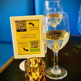 a glass of white wine and a glass of wine