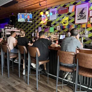 people sitting at the bar