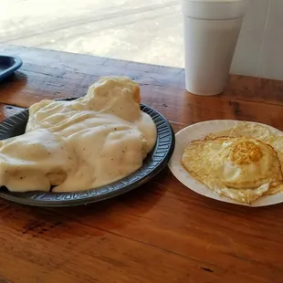 Biscuit with gravy and two fried eggs. The food is reiculously inexpensive. Such a good deal and good food.