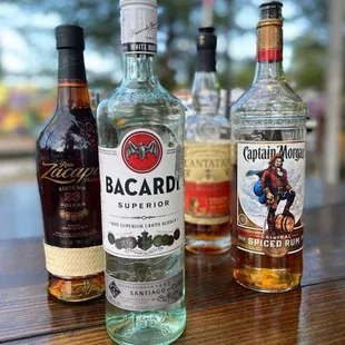 three bottles of bacardi