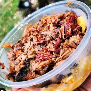 a person holding a bowl of food