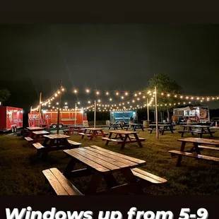 a photo of a picnic area at night