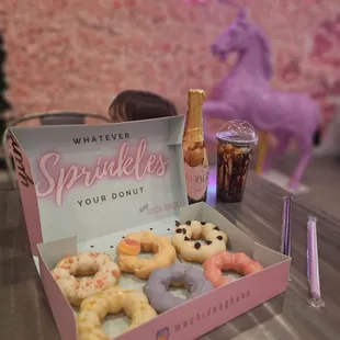 Variety of mochi donuts and milk tea bobba with the cute decoration.
