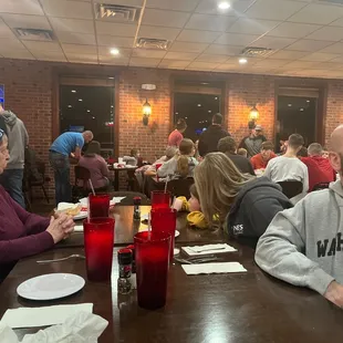 a group of people sitting at a table
