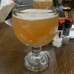 a glass of beer on a table