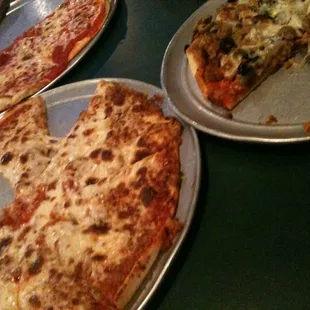 a half eaten pizza and half eaten pizza