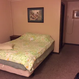 a single bed in a motel room