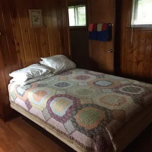 a bed with a quilt on it