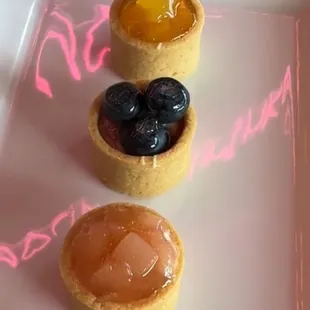 Bobo mini fruit tarts - mango, blueberry, peach! 
We also have strawberry mini tart and lemon mini tart as well as mini macarons.