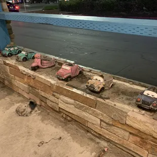 Cute little car planters.  Would be even cuter if they filled them all!