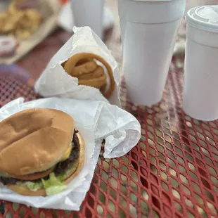 a hamburger and fries on a table