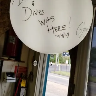 a white balloon with writing on it