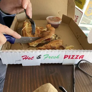 a box of hot and fresh pizza