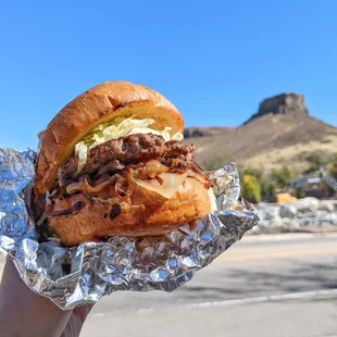 Cheeseburger with grilled onions, mushroom, lettuce and swiss cheese