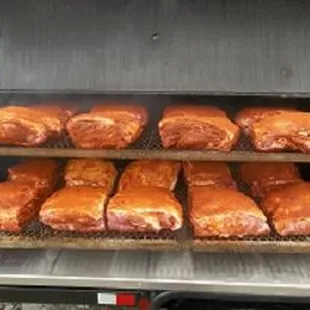 Getting ready to fire up the smoker filled with pork.