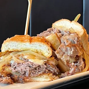 Shaved prime rib, with carmelized onions and havarti cheese on a bread roll. Served with Aujus for dipping.