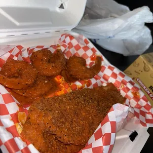 Shrimp and fish plate ( we requested to be tossed in lemon pepper and buffalo sauce) also got Mac and cheese (not pictured)