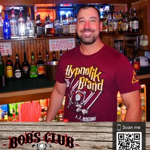 a man standing in front of a bar