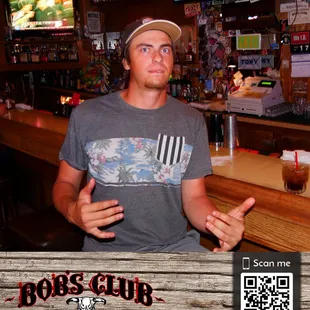 a man standing at a bar