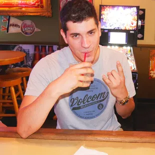 a man drinking a drink