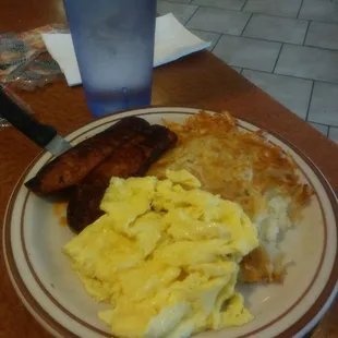 Linguica, scrambled eggs, and hash browns.