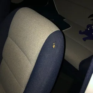 Cigarette burn on seat back