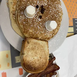 a plate of pancakes and bacon