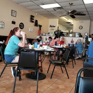 a woman sitting at a table