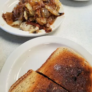 Rye toast well done and home fries with grilled onions.