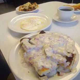 Creamed Chipped Beef on a Grilled Soft Pretzel, eggs over medium and home fries