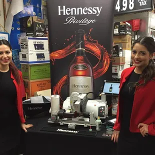 two women standing in front of a display