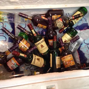a variety of bottles in a cooler