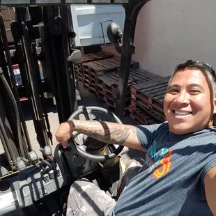 Having fun driving the forklift
