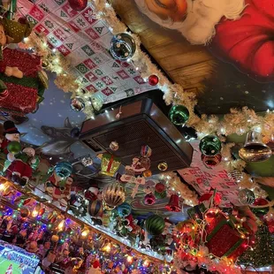 a ceiling covered in christmas decorations
