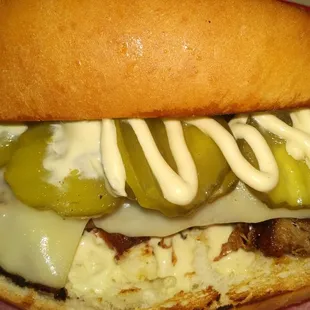 a sandwich with pickles and cheese