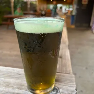 a glass of beer on a table