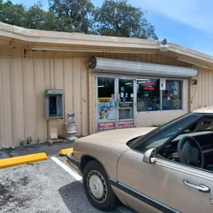 a car parked in front of the store