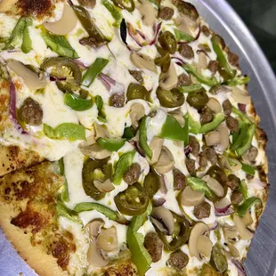 Thin crust Pesto with sausage, onion, bell pepper, &amp; jalapeño.