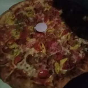 The pizza that might have been good if it was prepared correctly and had not set for an hour!