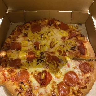 a pepperoni pizza in a box