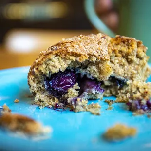 a half eaten blueberry muffin