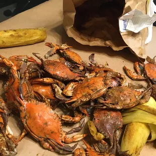 crabs and bananas on a cutting board