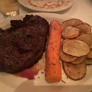 18oz Ribeye and skillet potatoes. Bob's carrots on all plates. This steak was so tender, juicy and delicious. Wow.