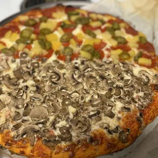 Half only mushroom and half pineapple, pepperoni, and jalapeño.