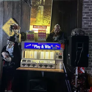 a man and a woman playing a slot machine