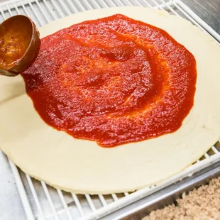 a person making a pizza