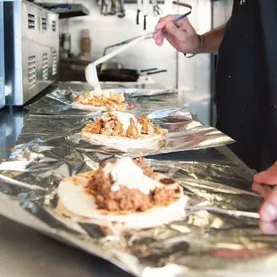 a man preparing food in a commercial kitchen
