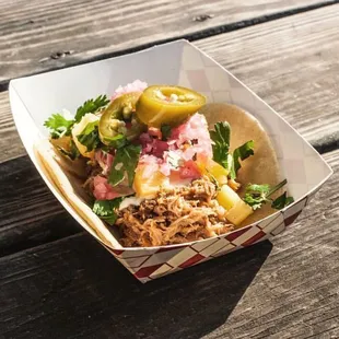 a taco sitting on a picnic table